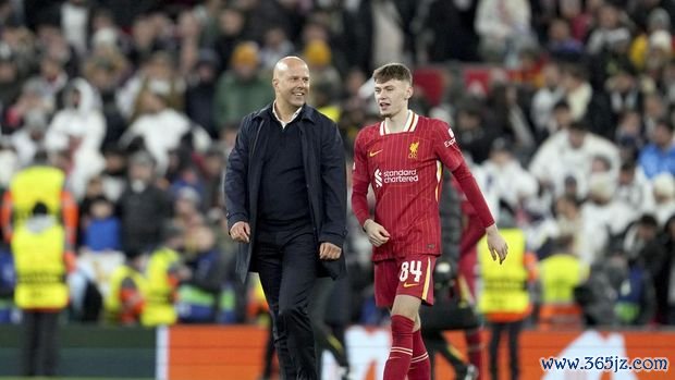 Liverpool's manager Arne Slot and Liverpool's Conor Bradley react at the end of the Champions League opening phase soccer match between Liverpool and Real Madrid at Anfield Stadium, Liverpool, England, Wednesday, Nov. 27, 2024. (AP Photo/Jon Super)